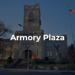 Armory Plaza building with flag, eagle statue, and distinctive architecture. Projects in Brooklyn, NY, often involve historic landmarks.
